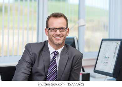 friendly-businessman-wearing-glasses-sitting-260nw-157773962